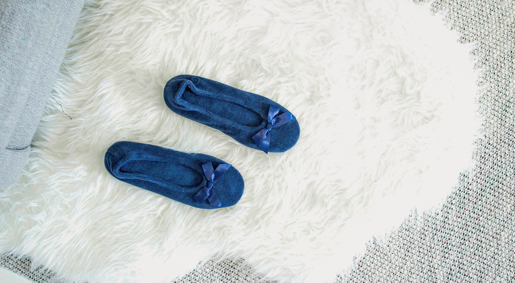 Classic Terry Ballerina Slippers on fuzzy fur rug