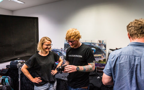 Ed Sheeran receiving his bottles