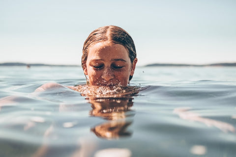 woman with head in the water 