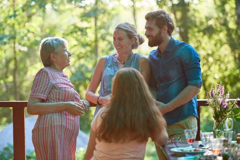 Woman speaking with her family 