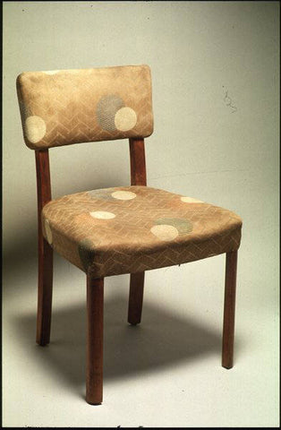 Walnut chair designed by W.H.Russell FSIAD in 1933. Upholstered in cotton by Edinburgh Weavers in 1935, designed by Ashley Havinden. Made for Gordon Russell Ltd and loaned by the Geffrye Museum, London. SIAD exhibition at the Design Council, Design Centre, London 1981. Credit: VADS and The Design Council Slide Collection at Manchester Metropolitan University Special Collections