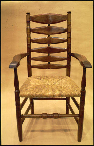 Chair with arms, in yew with laburnum bobbins. Designed by Gordon Russell in 1927 and made by Russell Workshops Ltd. (with turning by R. Pepper) in 1928. Credit Manchester Met Design Council Slide Collection