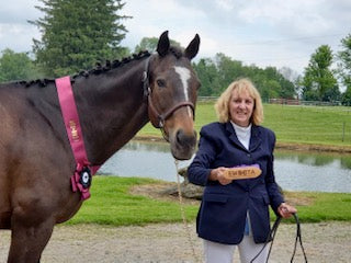 hunter rider diane williams and her horse benny with the red ribbon from a horse show. gastropower, horse supplement, ulcerguard, ulcer treatment, minerals for horses, show jumping, hunter rider, equestrian,equsani