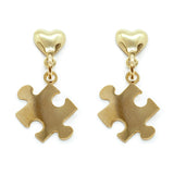 Stylish earrings with puzzle piece motifs, crafted in elegant gold, highlighting autism awareness and fashion unity.