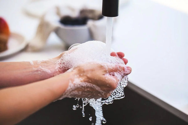 Washing hands with tap water