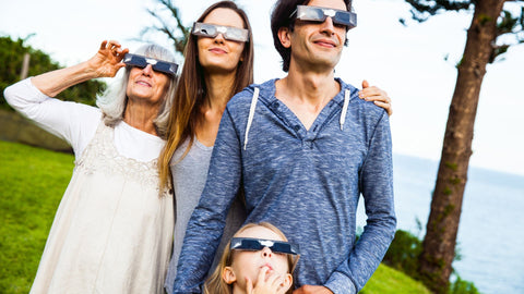 Family viewing solar eclipse