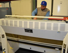 tech working on fume hood