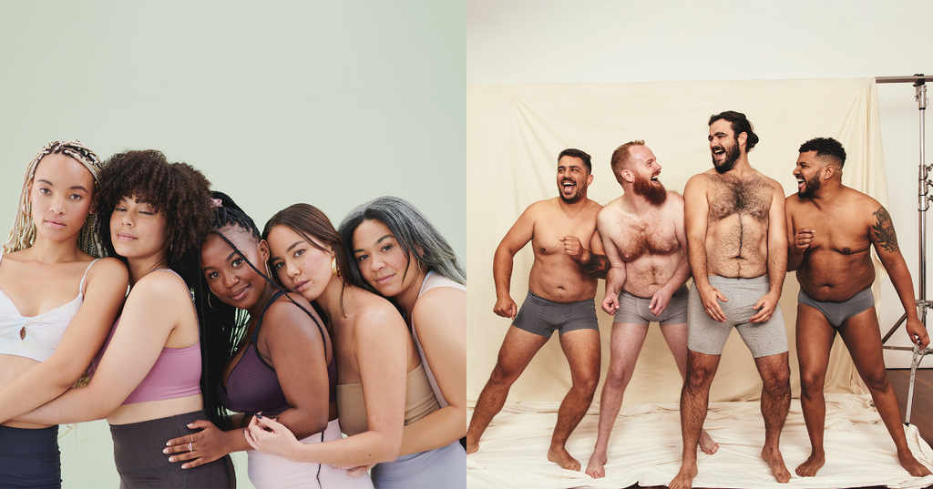 Women holding each other while four men in underwear laugh together at a photoshoot.