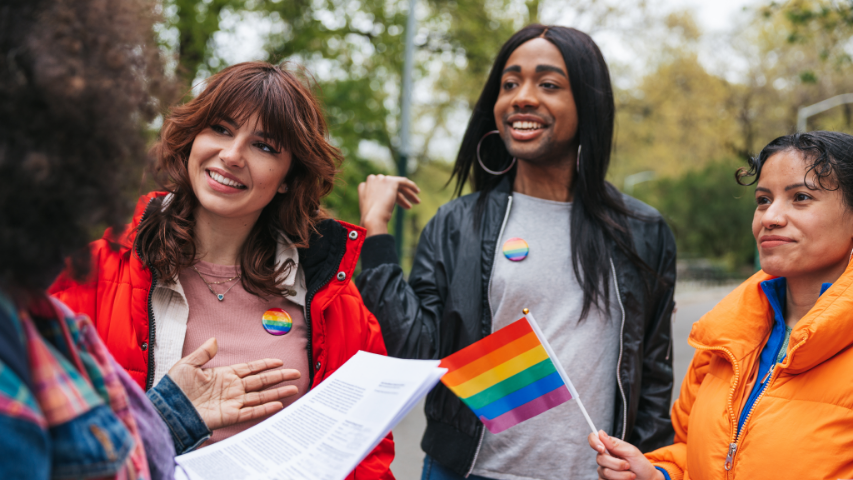 Group of friends gathering together to speak to other members of the LGBTQIA+ community during Pride month.