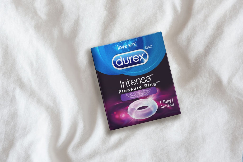 Durex cock ring on a bed sheet