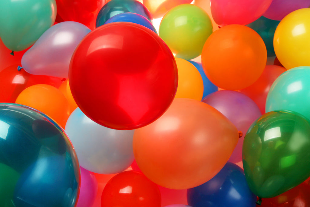 Several colourful latex balloons.