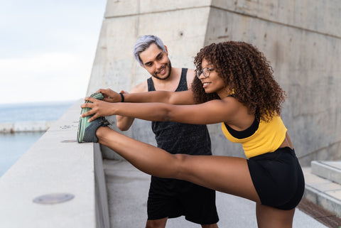 A man and woman connecting and getting to know each other while trying out a new hobby.