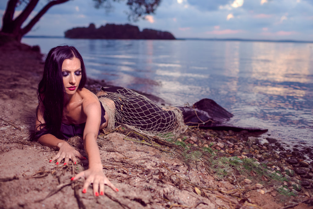 A mermaid awaits her lover’s touch.