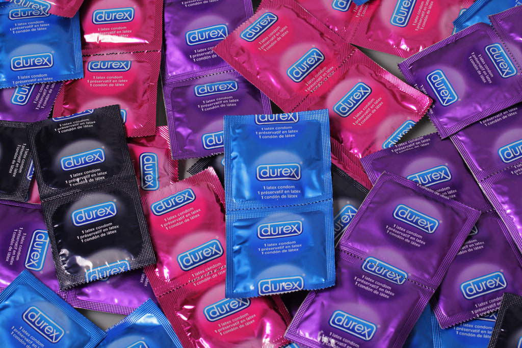 Different varieties of Durex condoms in wrappers.