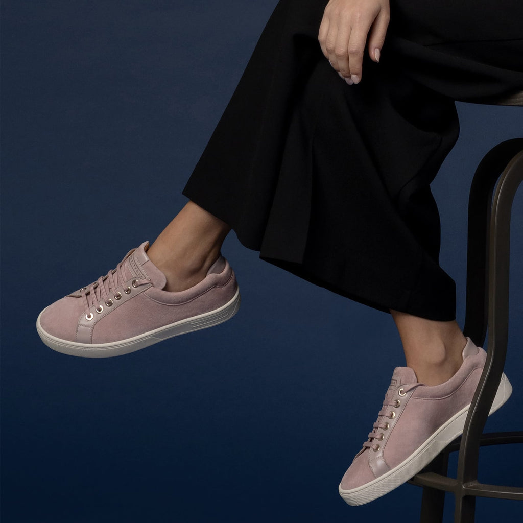 female seated down with feet shod in pink sneakers turkish delight small size shoes model from petitfour feeling good collection