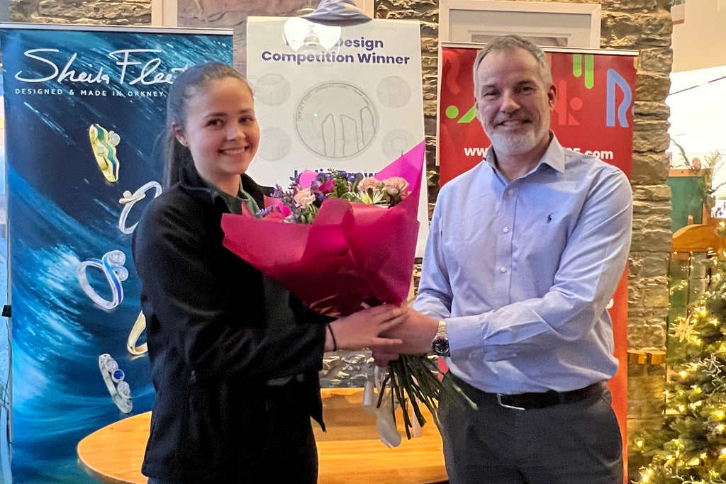 Chair of the Orkney Island Games Association, Gordon Deans with winner of competition, Jodie Brown.