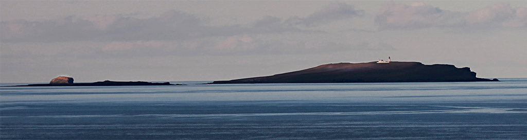 The lighthouse on Copinsay, with the Horse of Copinsay in the distance, two uninhabited islands off Orkney's East Mainland (Photo: Rick Fleet)