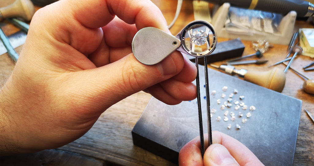 Examining diamonds in the Sheila Fleet Jewellery workshop.