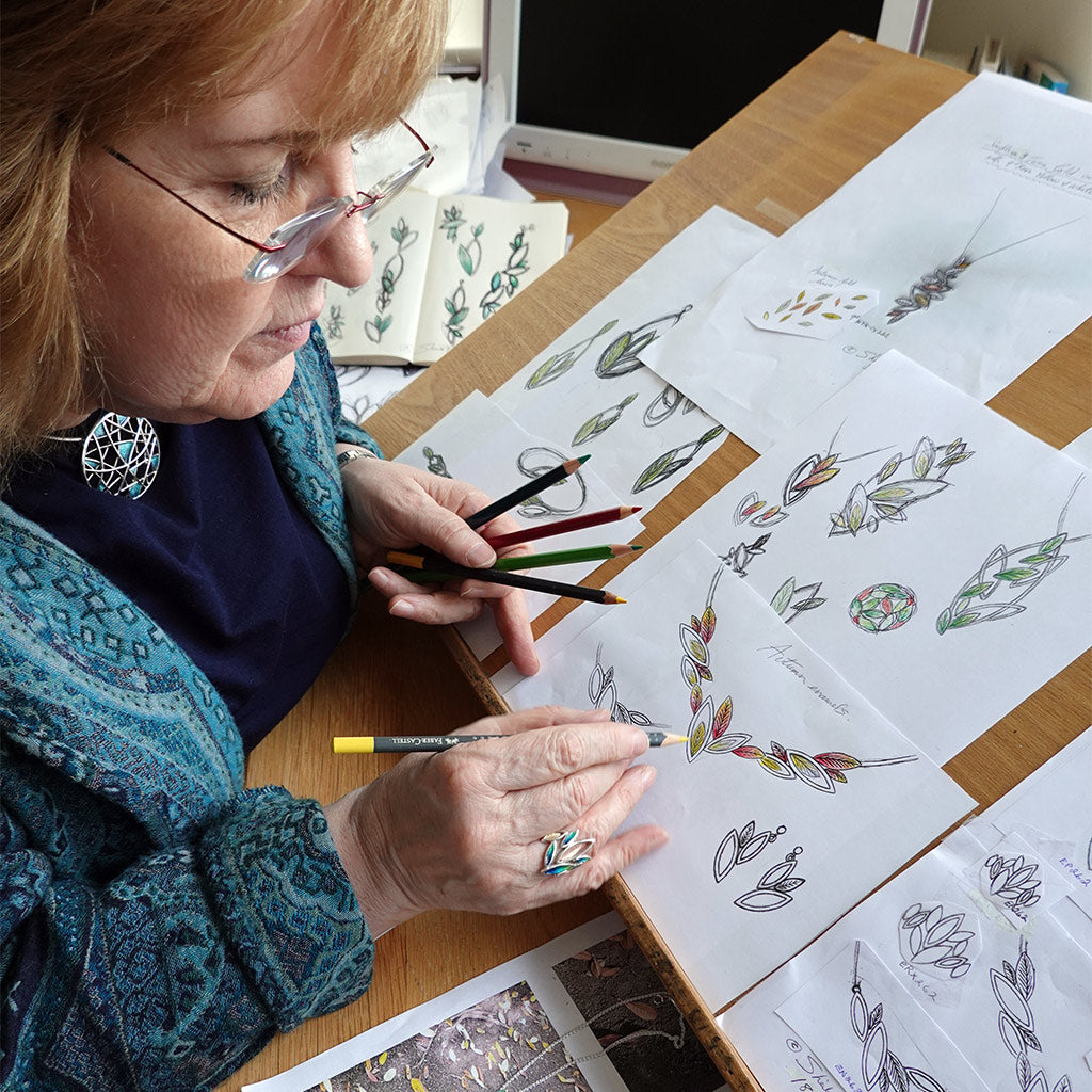 Sheila Fleet sketching designs for her Seasons collection.