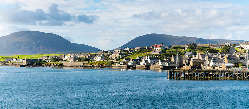 The town of Stromness with the Hoy Hills in the background (Photo: VisitScotland / Kenny Lam)