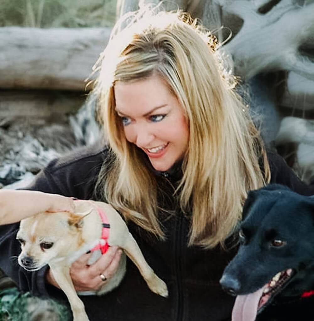 Animal advocate Colleen Paige with two dogs