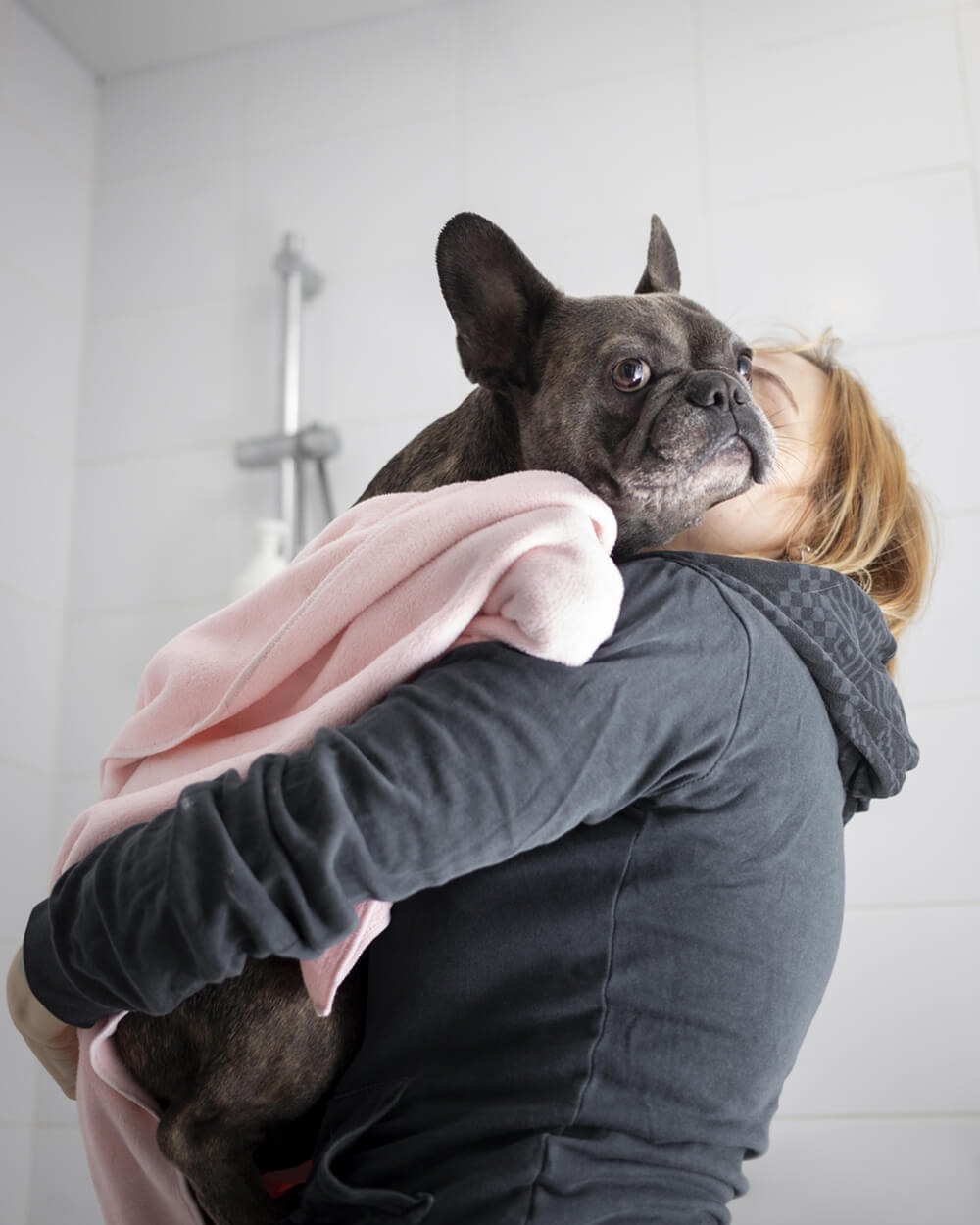 Unconditional love between a dog parent and dog, a Frenchie bull dog