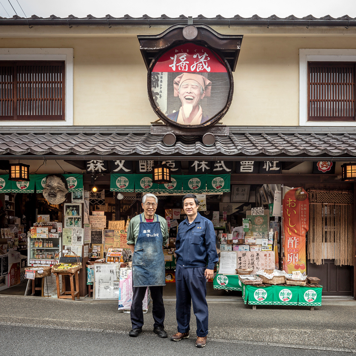 Two founders standing in front of store