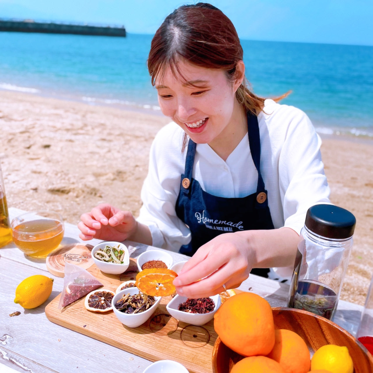 Women enjoying herb tea in beach