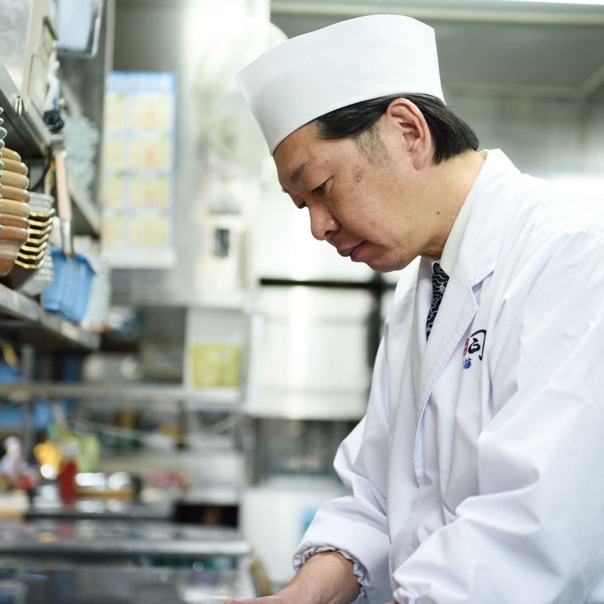 Chef cooking at restaurant kitchen