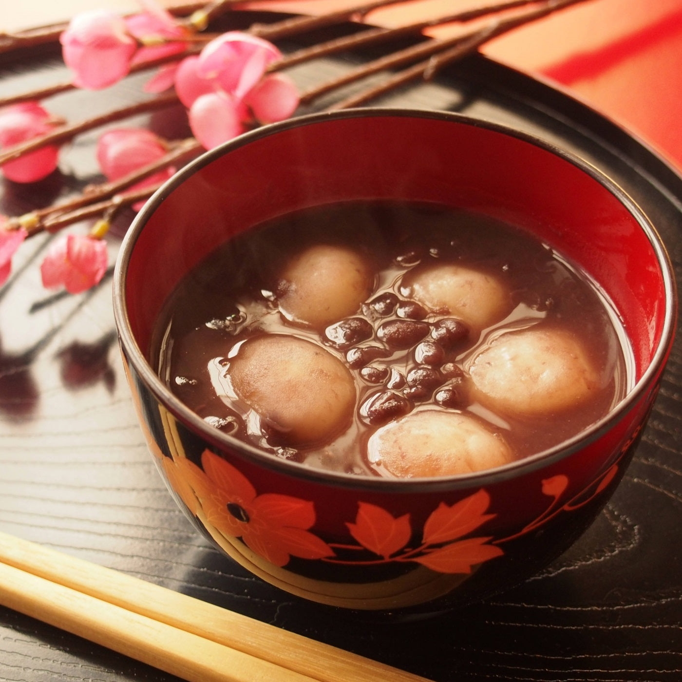 A bowl of sweet red bean soup with mochi