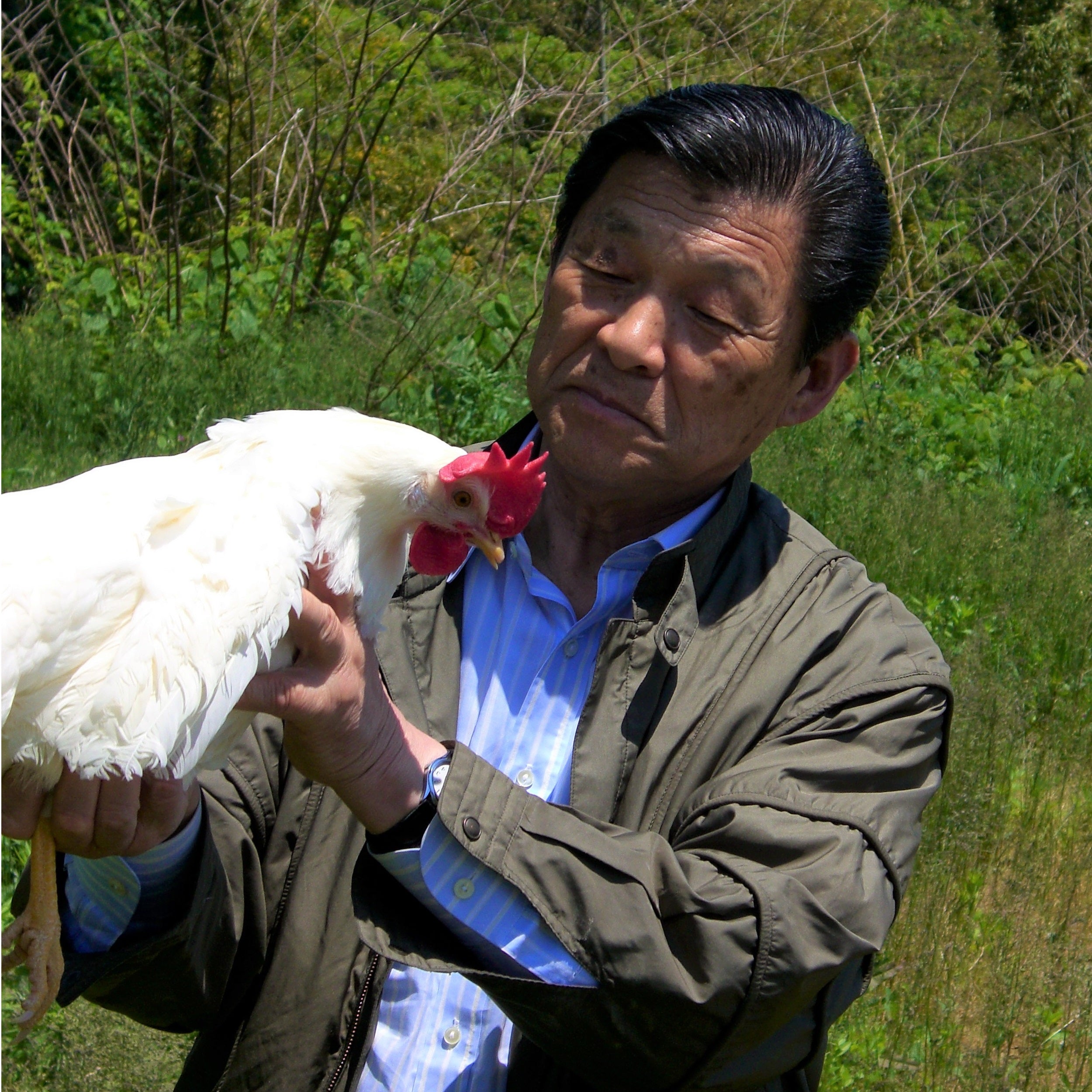 Man holding a hen