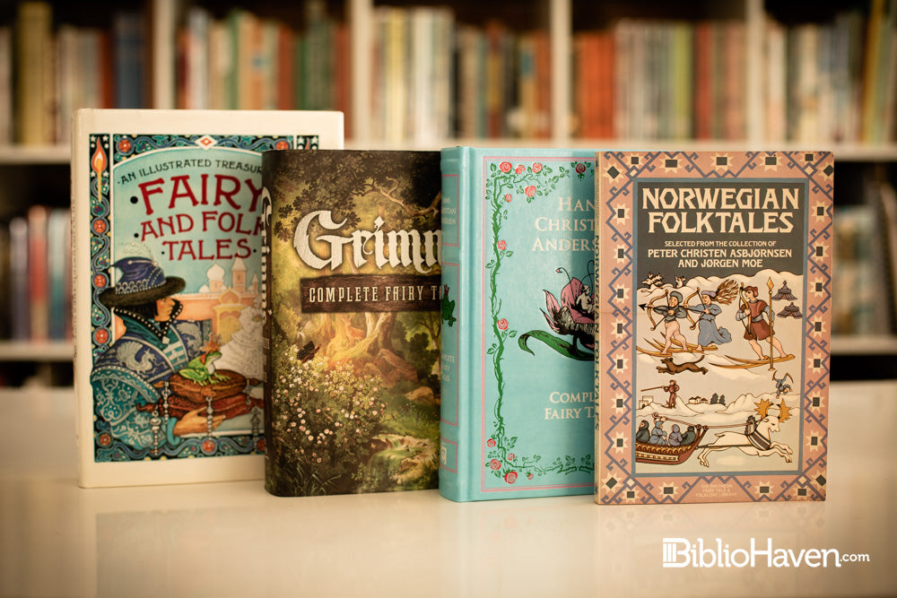 Four Folk and fairy tales books shown in front of hundreds of books on a shelf blurred in the background.