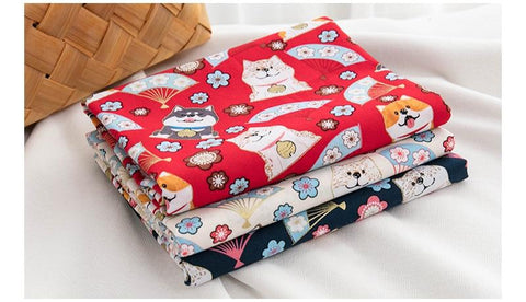 patterned fabric, red, blue and white with shibas all over them