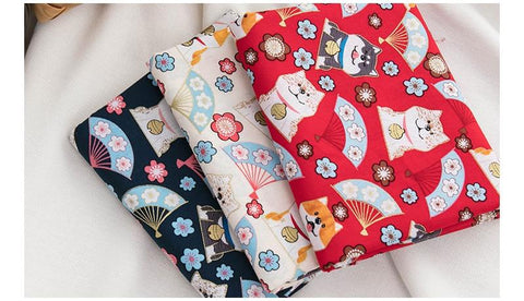 red, blue and white fabric with shibas on it