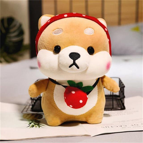 a shiba cutie plush with a strawberry