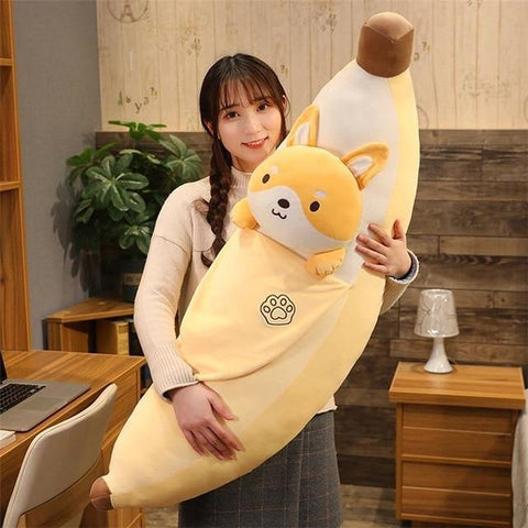 Shiba banana plushie with woman hugging it