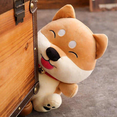 shiba inu stuffed animal poking its head around the corner of a waldrobe