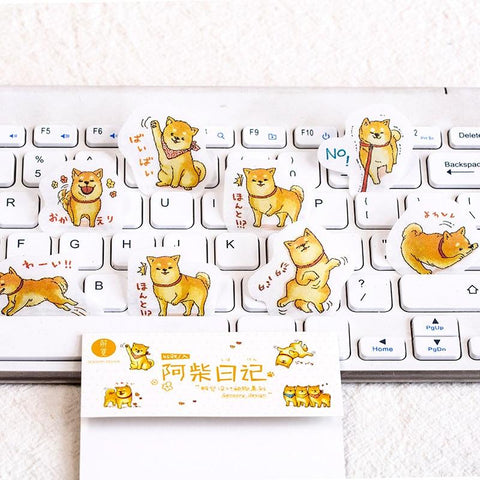 Shiba inu stickers on a keyboard