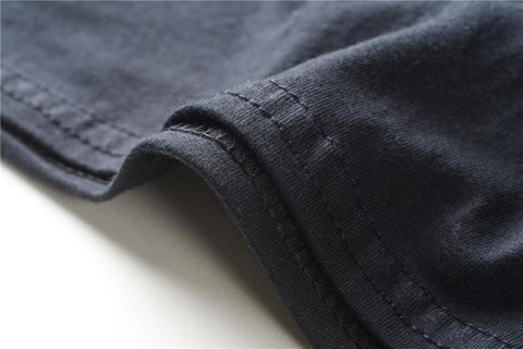black fabric spiralled around in a t-shirt