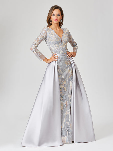 Lara 29468 - Long Sleeve Lace Gown with Removable Over Skirt Lara 29468 - Long Sleeve Lace Gown with Removable Over Skirt Lara 29468 - Long Sleeve Lace Gown with Removable Over Skirt LARA 29468 - LONG SLEEVE LACE GOWN WITH REMOVABLE OVER SKIRT