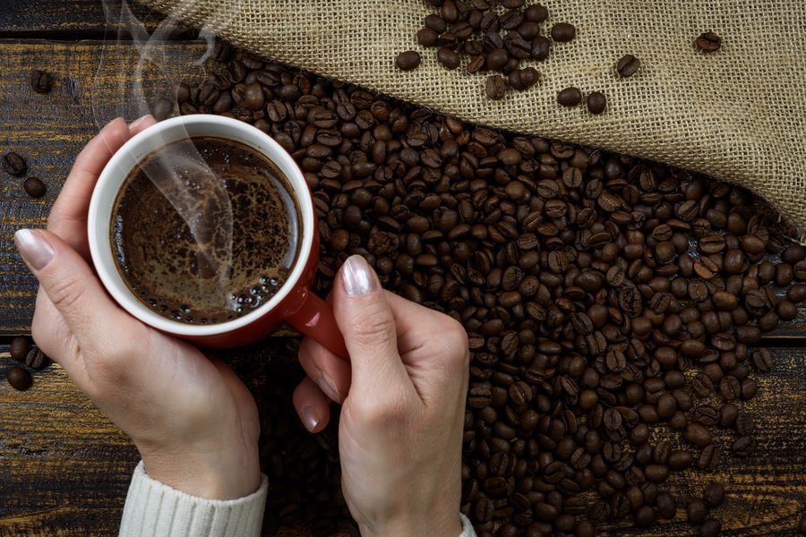 Person enjoying a cup of French Press coffee