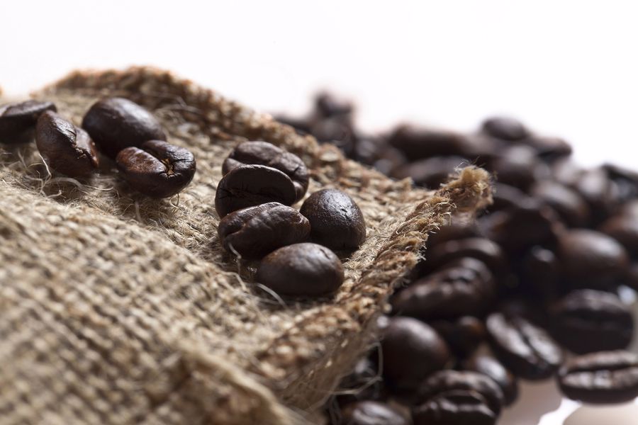 Coffee beans spilling out of a sack