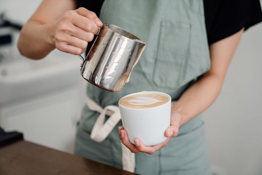 Person doing latte art