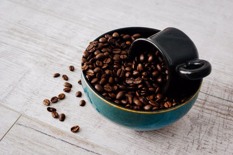 Mug on top of coffee beans