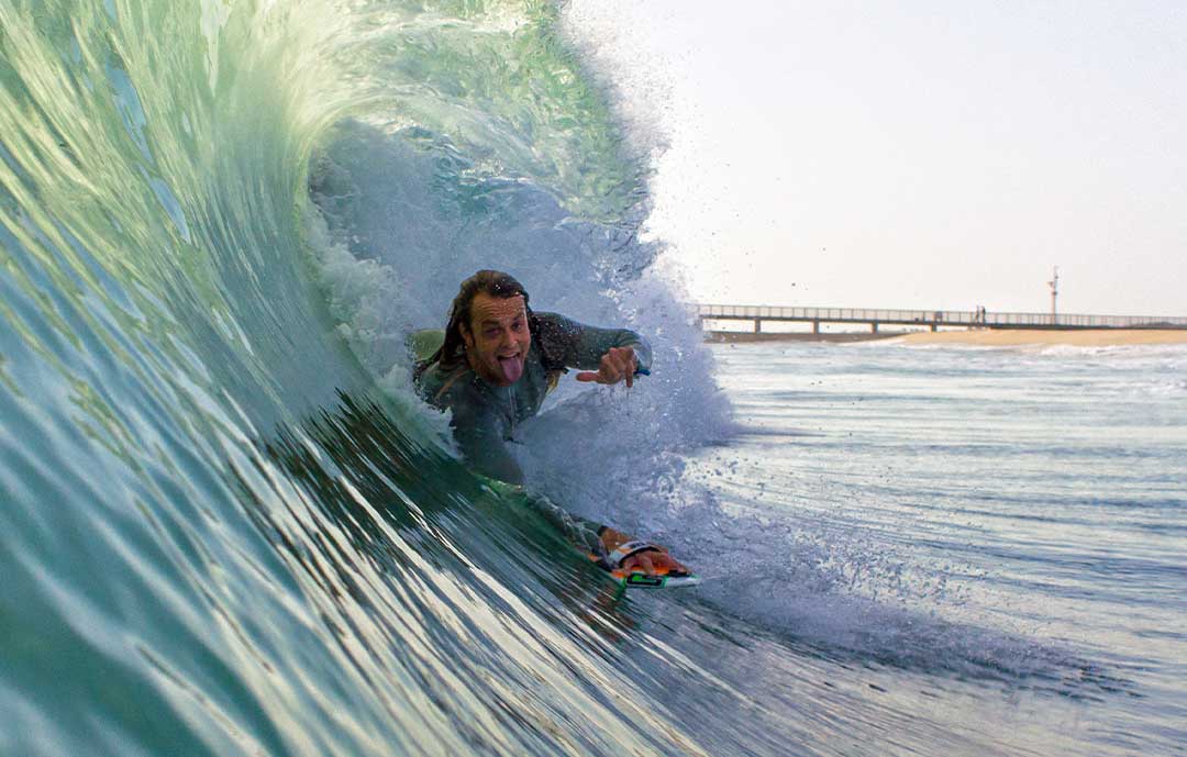 How Is Surfing Good For Student's Mental Health Man Bodysurfing and handboarding Slyde In Florida 