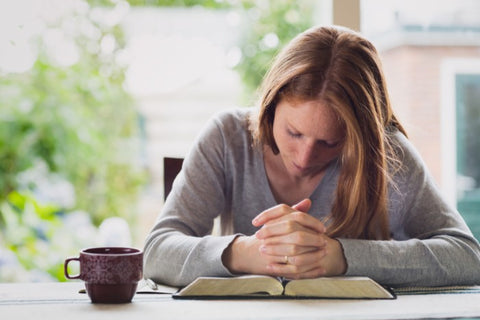 woman praying in the morning