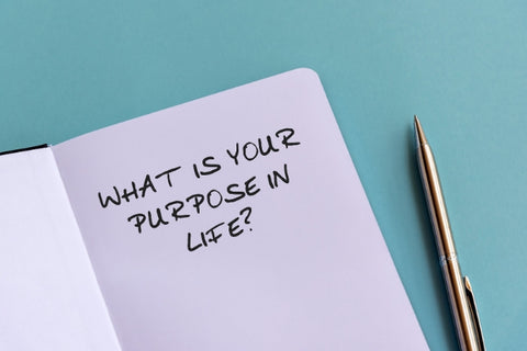 what is your purpose in life question written on a notebook