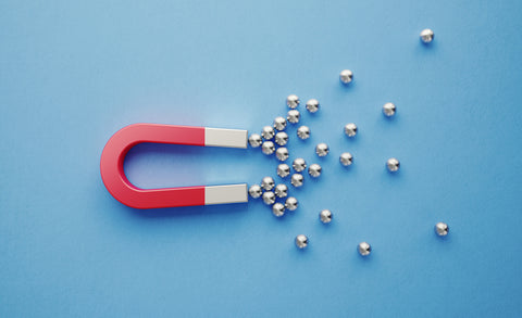 Magnet attracting metal balls