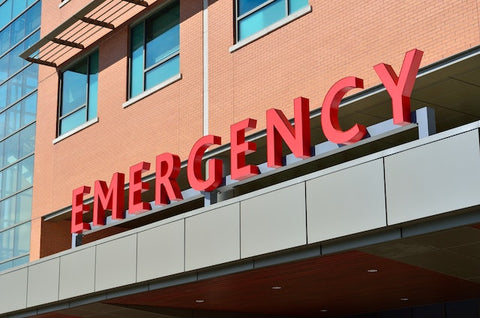 Emergency Room emergency signage on top of building cover