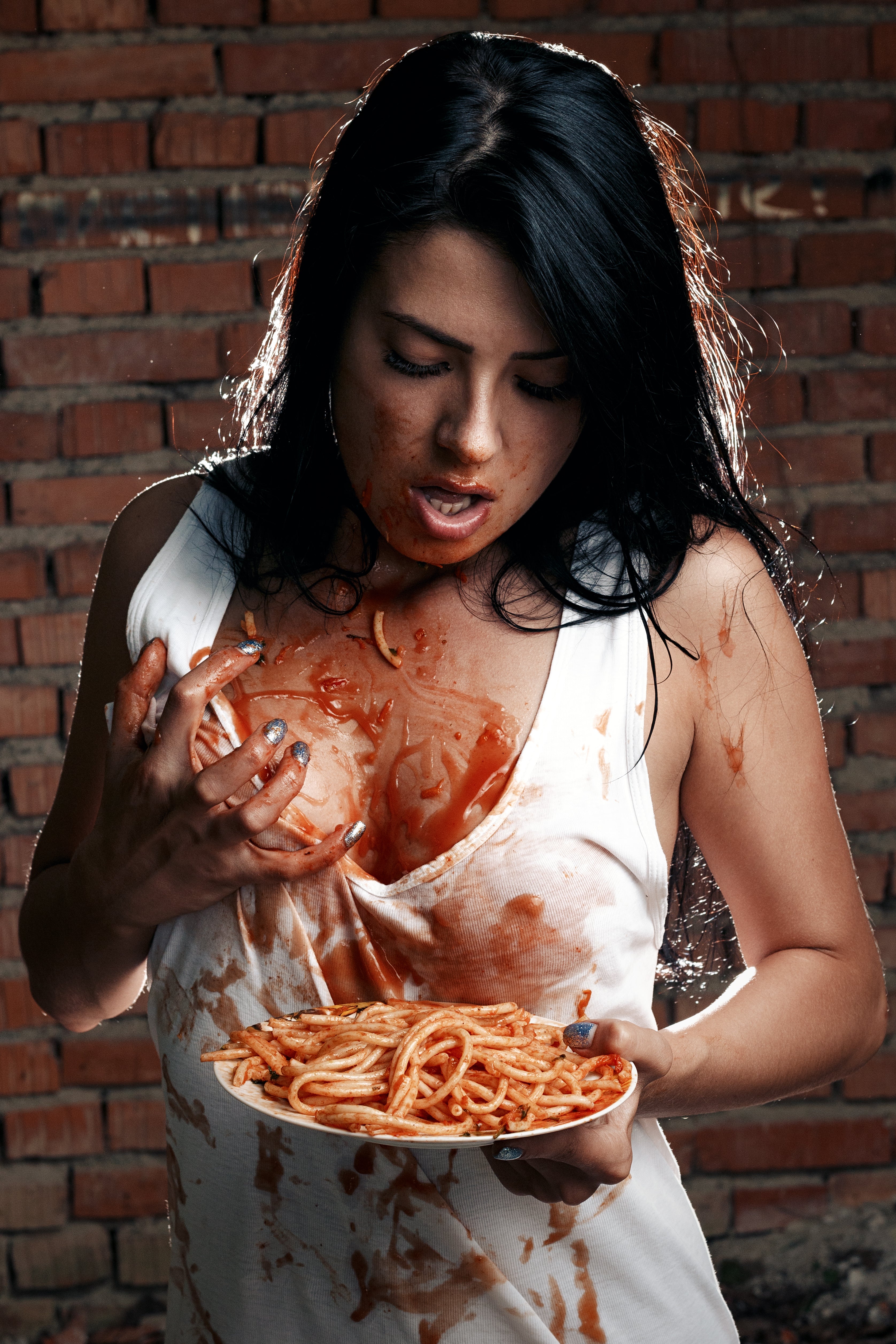 Beautiful Woman Spilling Spaghetti and Sauce All Over Herself!